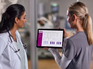 Two nurses looking at ipad 