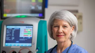 Healthare professional in front of the Prismaflex System