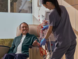 Healthcare professional giving treatment to patient