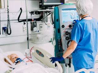 Healthcare professional interacts with the Prismaflex System