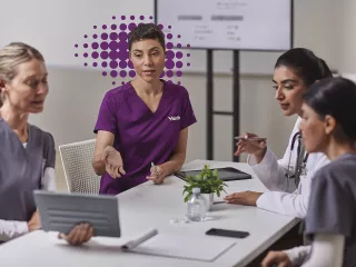 Nurses sitting around table 